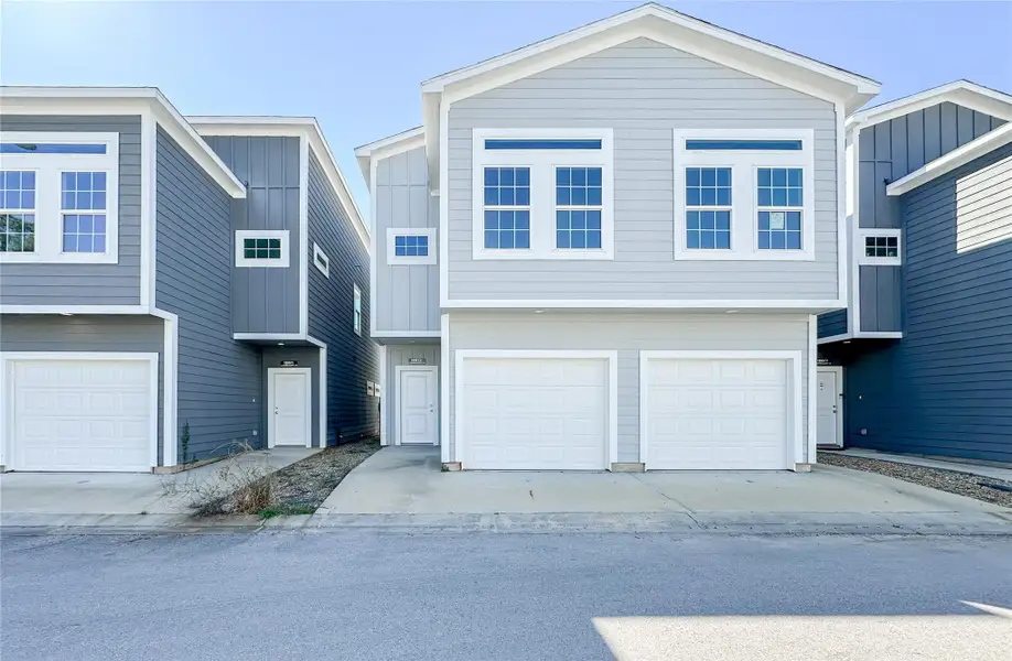 Front exterior of a new home in , Spring, TX, highlighting curb appeal (Image 1).