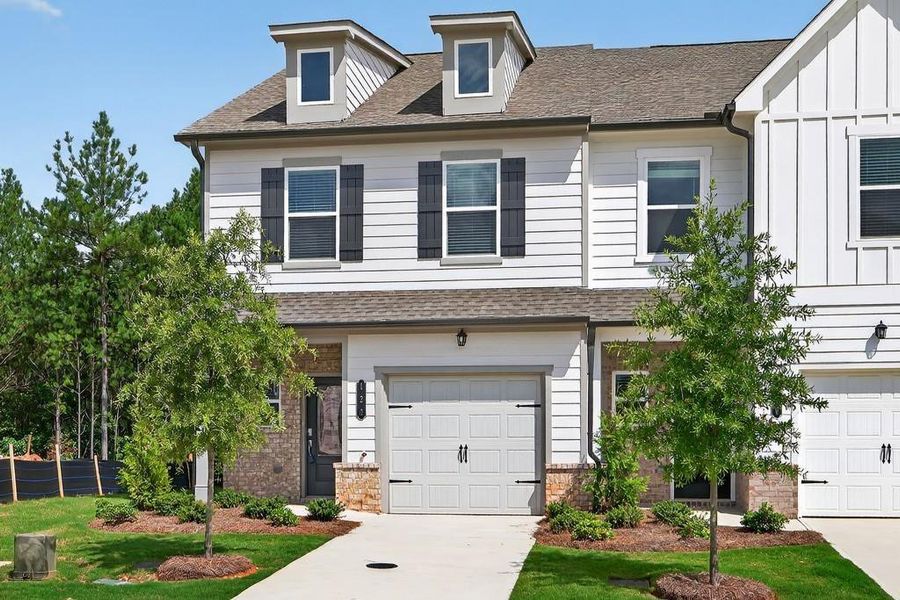 Front exterior of a new home in Fernhurst, McDonough, GA, highlighting curb appeal (Image 19). Front exterior of a new home in Fernhurst, McDonough, GA, highlighting curb appeal (Image 19).