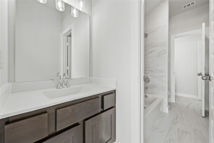 Furnished interior view inside a new home in Sunterra, Katy (Image 10).