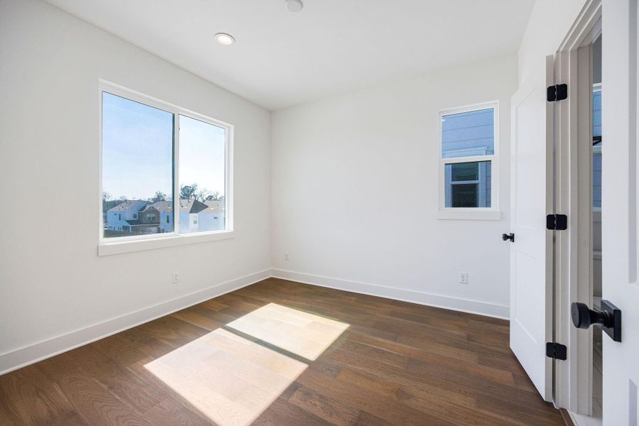 Secondary bedroom located on the third floor with an attached full bathroom