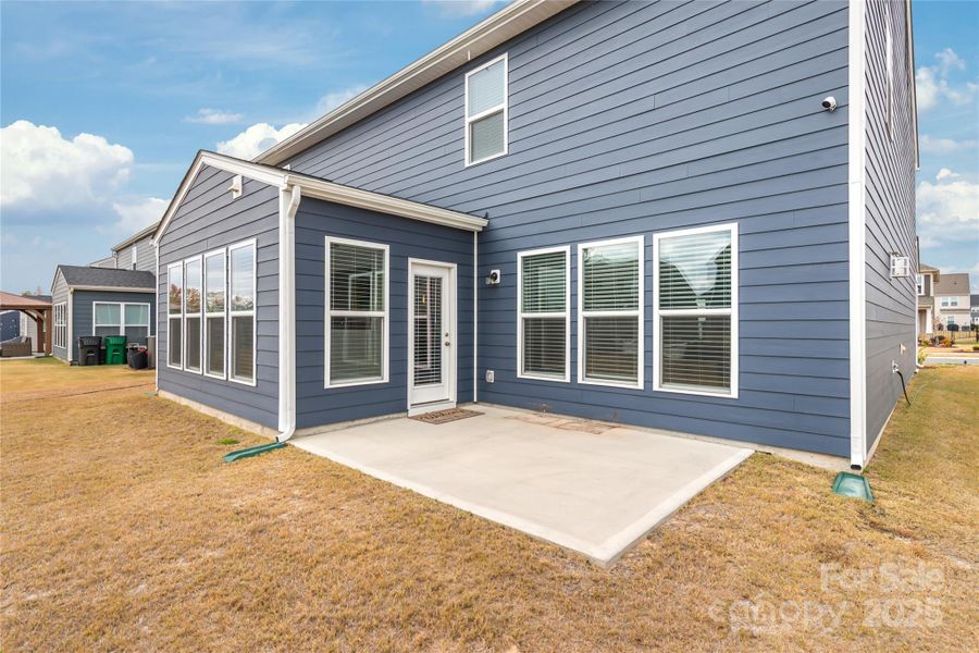 Oversized patio just off the enclosed sunroom is great for grilling or enjoying a beverage on the outdoor sofa Oversized patio just off the enclosed sunroom is great for grilling or enjoying a beverage on the outdoor sofa