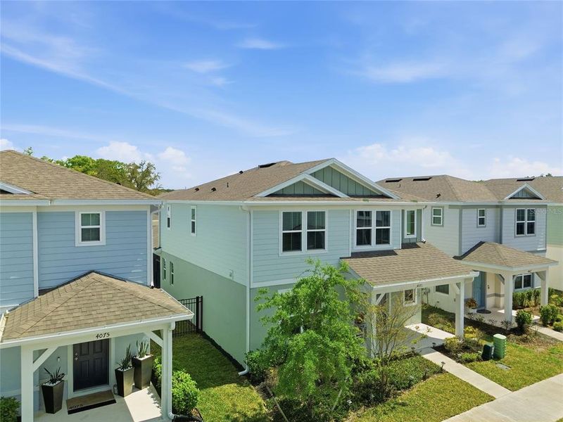 Front exterior of a new home in Winding Meadows, Apopka, FL, highlighting curb appeal (Image 25).