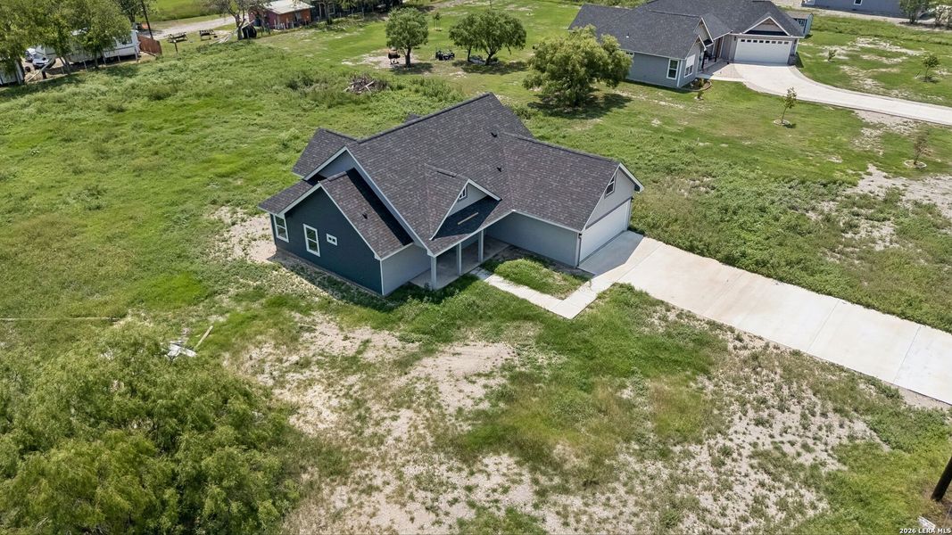 Front exterior of a new home in , Natalia, TX, highlighting curb appeal (Image 16).