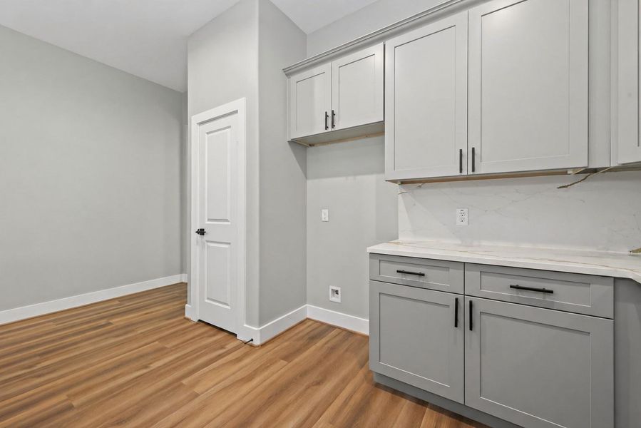 Thoughtfully designed kitchen featuring a large island, ample cabinetry, and an open flow to the main living areas.