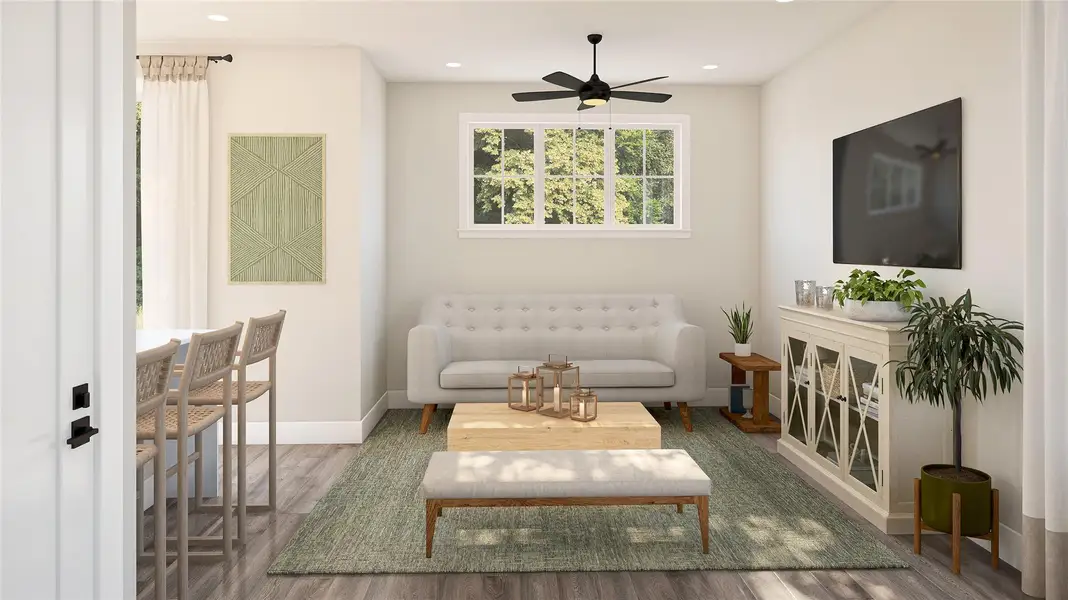 The Laurel Floor Plan - 3 Bed/2.5 Bath; Living room featuring LVP finished floors, recessed lighting, and a ceiling fan