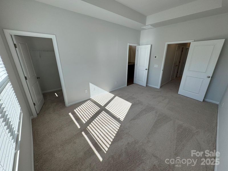 Primary Suite with 10' Boxed Tray Ceiling Primary Suite with 10' Boxed Tray Ceiling