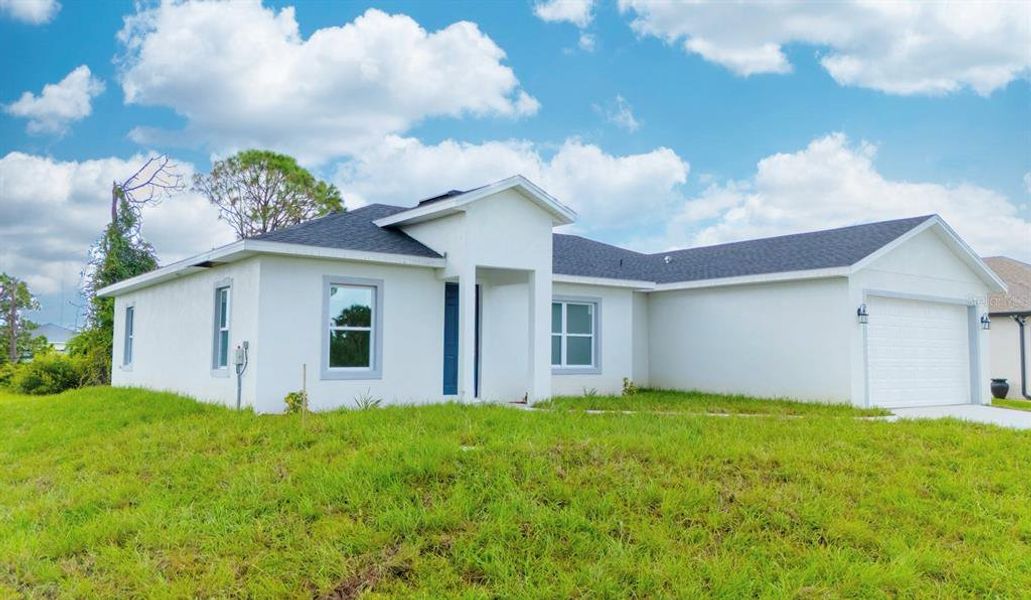 Front exterior of a new home in , Placida, FL, highlighting curb appeal (Image 2). Front exterior of a new home in , Placida, FL, highlighting curb appeal (Image 2).