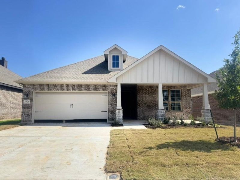 Front exterior of a new home in Liberty Pointe, Gainesville, TX, highlighting curb appeal (Image 2). Front exterior of a new home in Liberty Pointe, Gainesville, TX, highlighting curb appeal (Image 2).