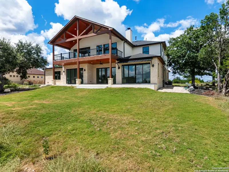Exterior details and patio area of a home in , Spring Branch (Image 3).