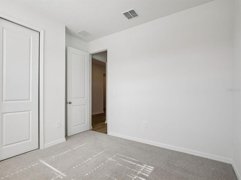 Spacious, unfurnished interior of a new home in Coasterra - Reserve Series, Palmetto (Image 10).