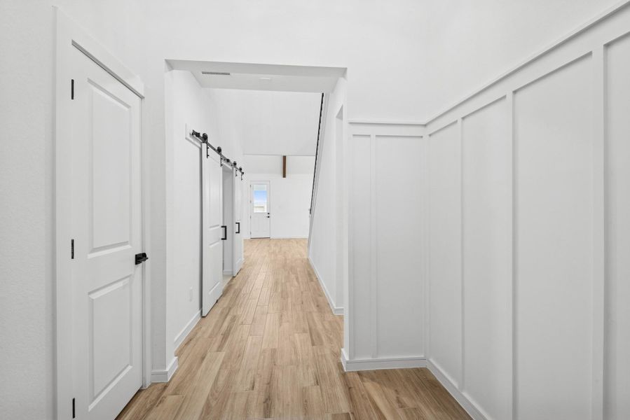 Welcoming foyer with feature wall