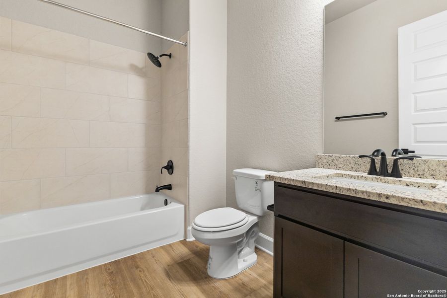 Furnished interior view inside a new home in The Enclave at Potranco Oaks, Castroville (Image 16).