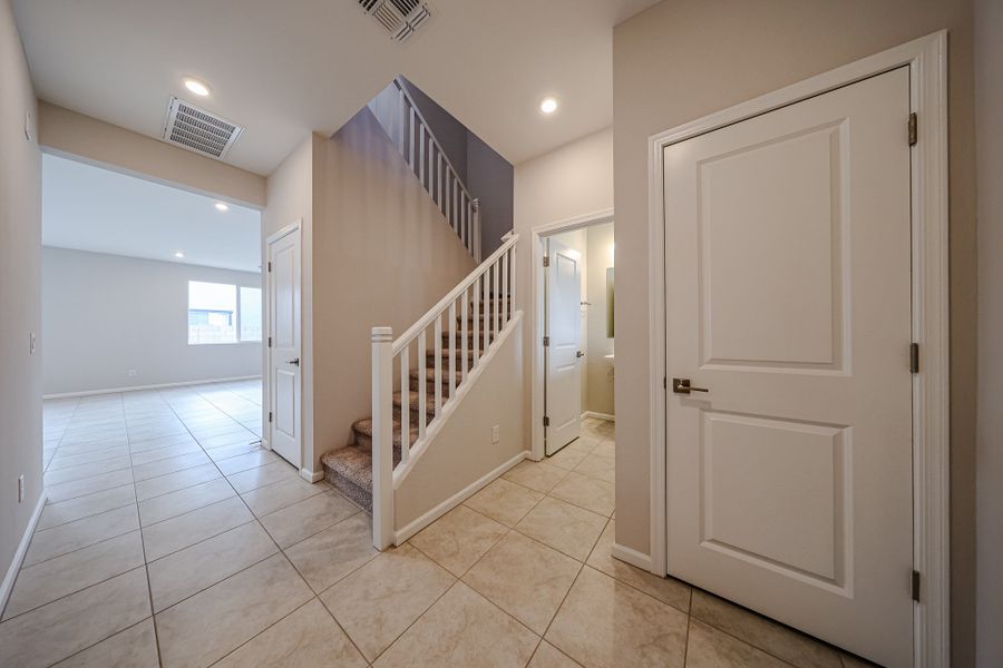 A hallway with white doors.