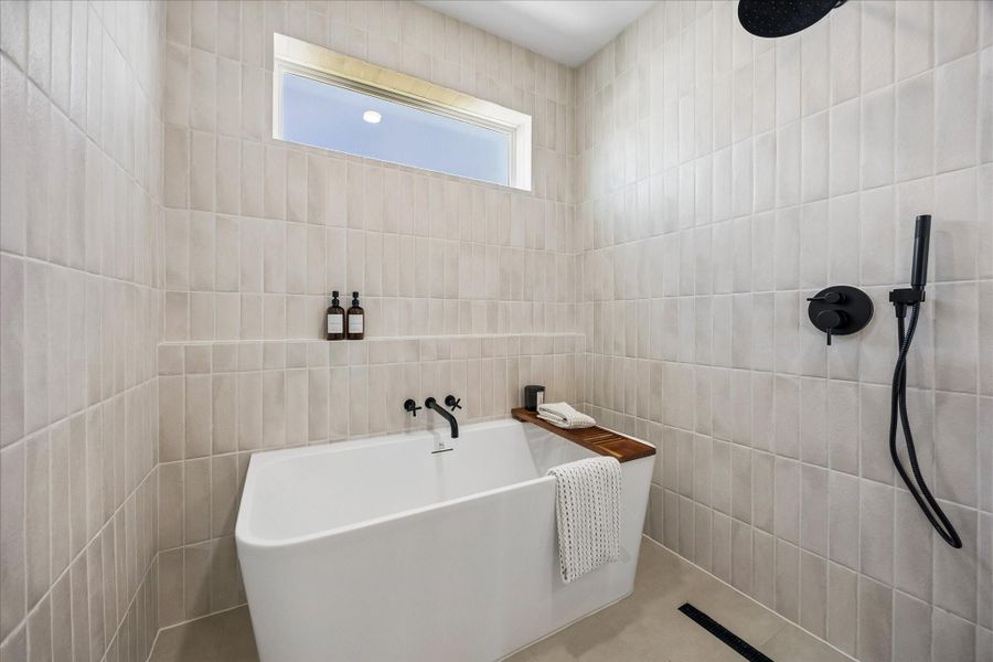 A freestanding soaking tub, oversized walk in shower, and carefully selected finishes combine to create a true spa inspired retreat. A freestanding soaking tub, oversized walk in shower, and carefully selected finishes combine to create a true spa inspired retreat.