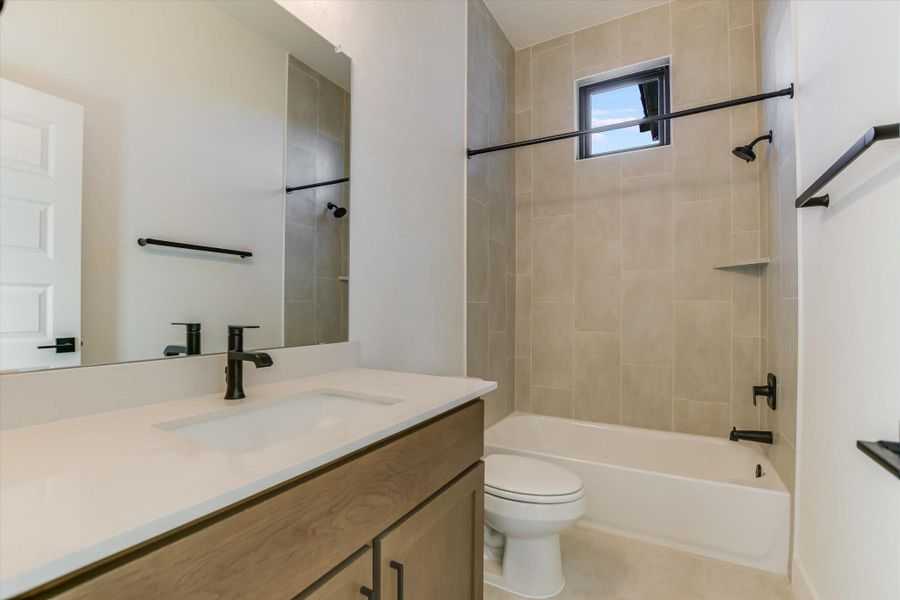 Bathroom featuring vanity and  shower combination