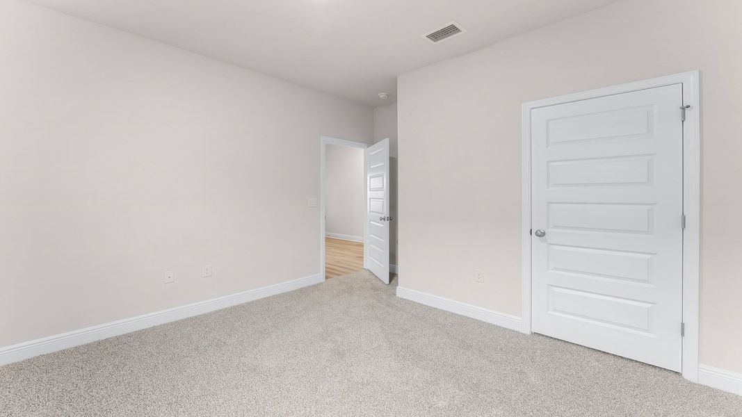 Representative unfurnished interior of a home built from the The Rhett by D.R. Horton in Hodges Bayou Plantation, Panama City (Image 19).