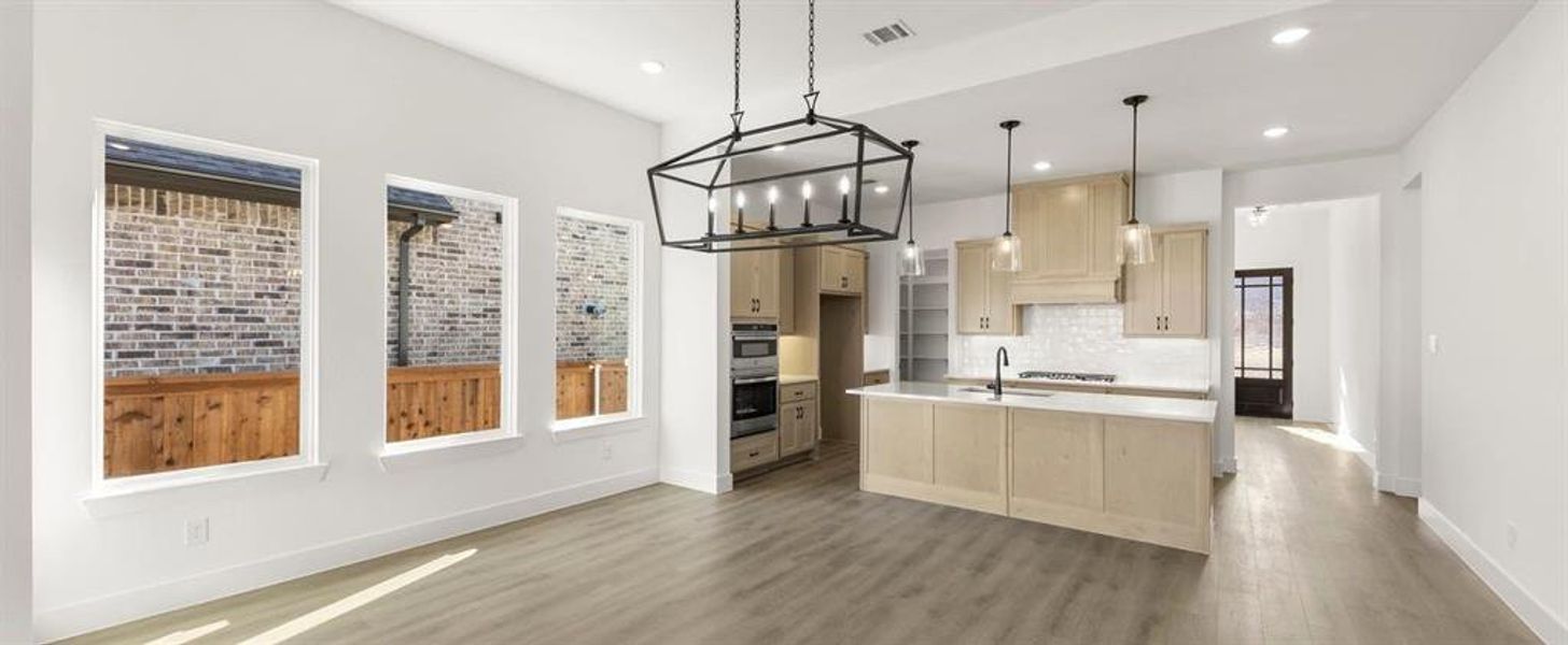 Open Kitchen-Dining Room featuring the Artisan Collection