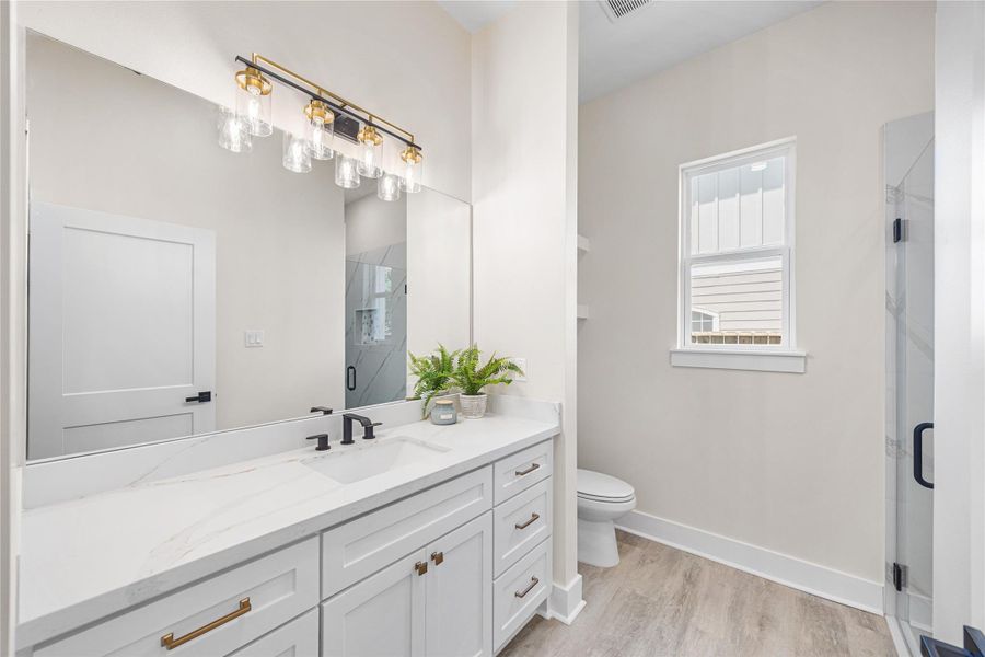 Spacious 3rd Bathroom with a Standup Shower, Plenty of Cabinet Space and Modern Features Just Steps Away From the 4th Bedroom..
