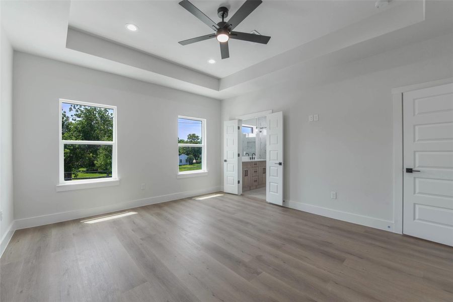 The upper level features a private primary bedroom with an ensuite bath and spacious walk-in closet. The upper level features a private primary bedroom with an ensuite bath and spacious walk-in closet.