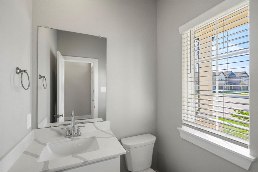 Half bathroom in the front of the home for your guests. Half bathroom in the front of the home for your guests.