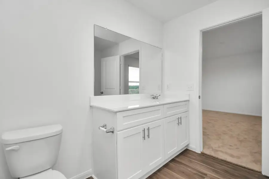 Furnished interior view inside a new home in Decker Farms, Magnolia (Image 11).