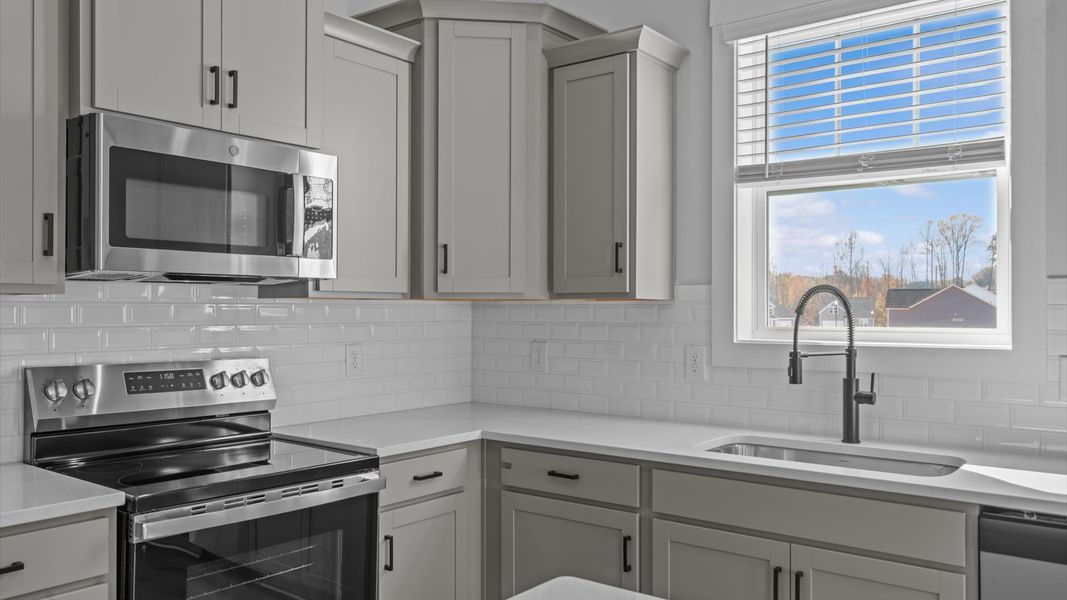 Modern kitchen with streamlined island for easy prep, storage, and gathering