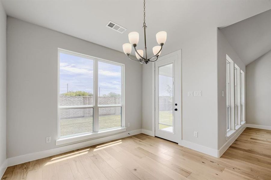 Light wood-finish flooring complements the neutral wall tones