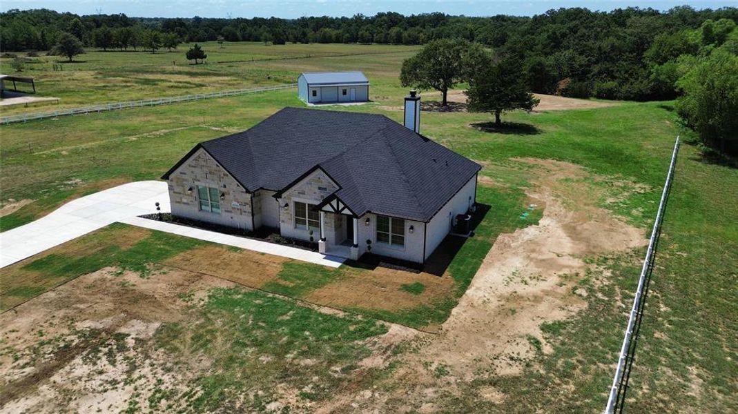 Front exterior of a new home in , Cumby, TX, highlighting curb appeal (Image 19). Front exterior of a new home in , Cumby, TX, highlighting curb appeal (Image 19).