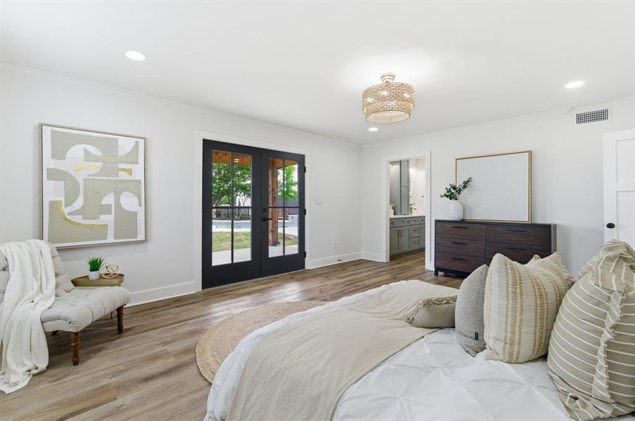 This property features light wood-style flooring, white walls, and recessed lighting This property features light wood-style flooring, white walls, and recessed lighting