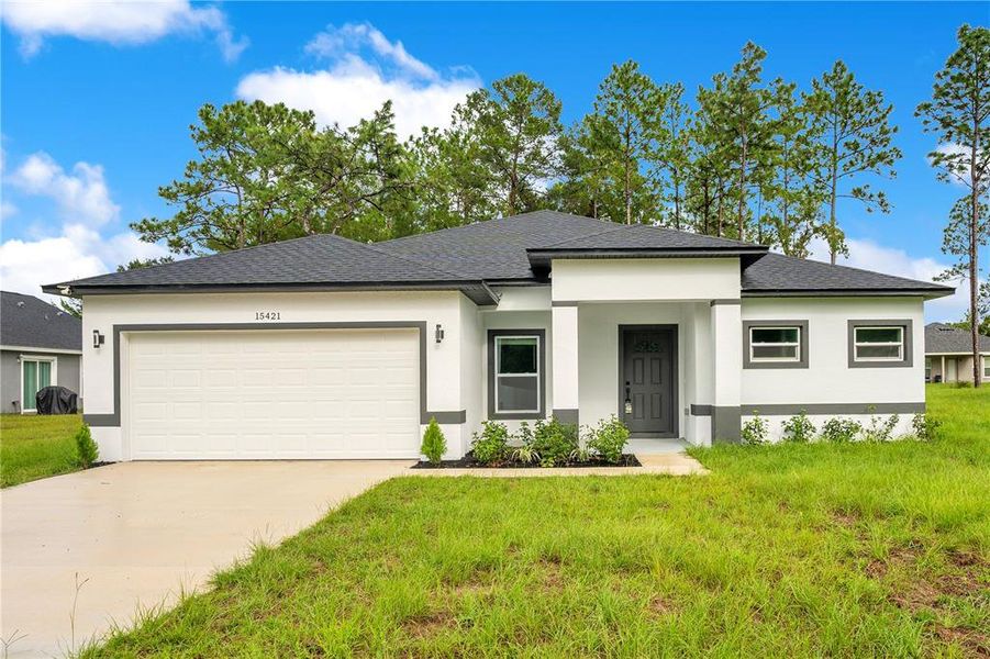 Front exterior of a new home in , Deltona, FL, highlighting curb appeal (Image 1). Front exterior of a new home in , Deltona, FL, highlighting curb appeal (Image 1).