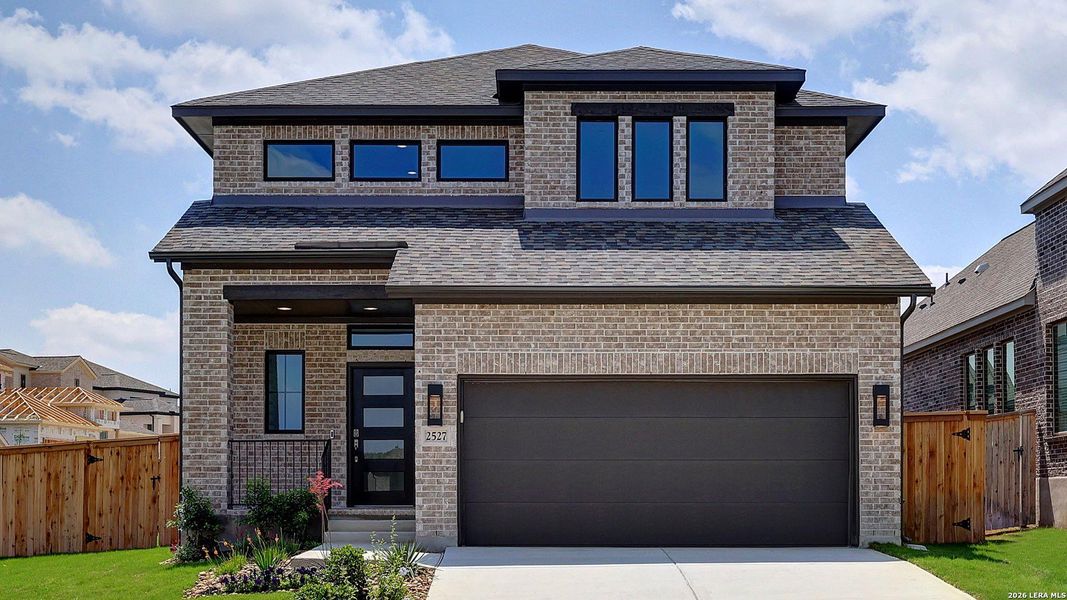 Front exterior of a new home in Ladera, San Antonio, TX, highlighting curb appeal (Image 1). Front exterior of a new home in Ladera, San Antonio, TX, highlighting curb appeal (Image 1).