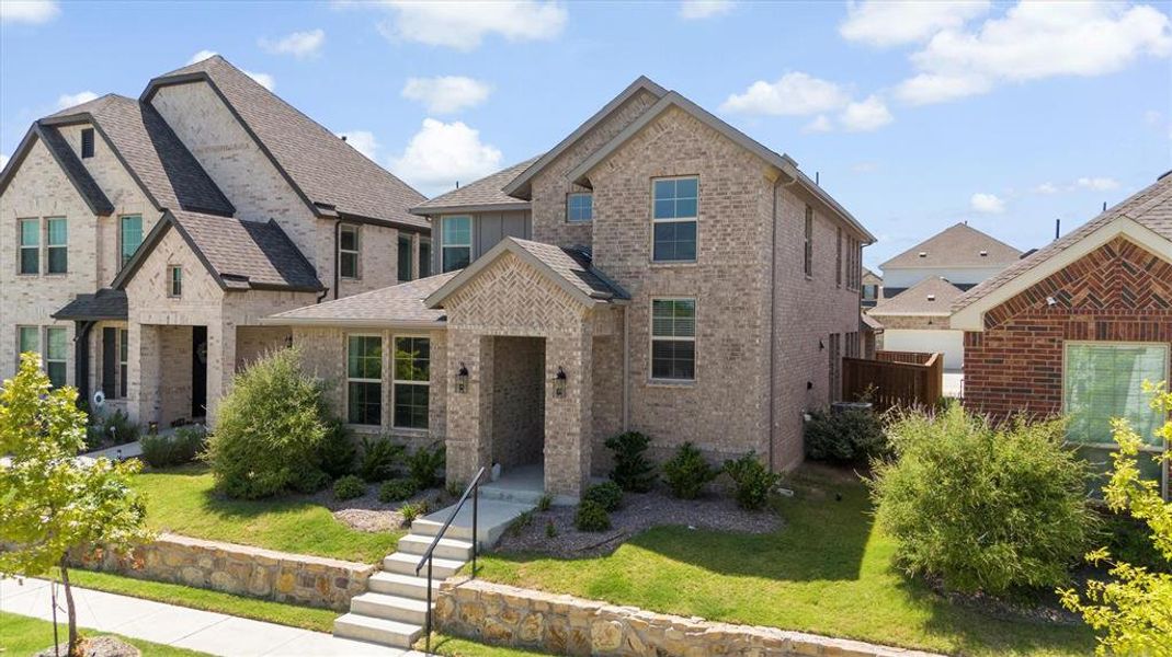 Front exterior of a new home in Riverset, Garland, TX, highlighting curb appeal (Image 26). Front exterior of a new home in Riverset, Garland, TX, highlighting curb appeal (Image 26).