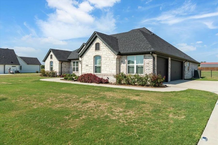 Front exterior of a new home in , Weatherford, TX, highlighting curb appeal (Image 18).