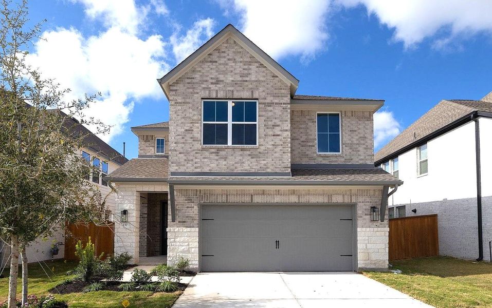 Front exterior of a new home in Parmer Ranch, Georgetown, TX, highlighting curb appeal (Image 2). Front exterior of a new home in Parmer Ranch, Georgetown, TX, highlighting curb appeal (Image 2).