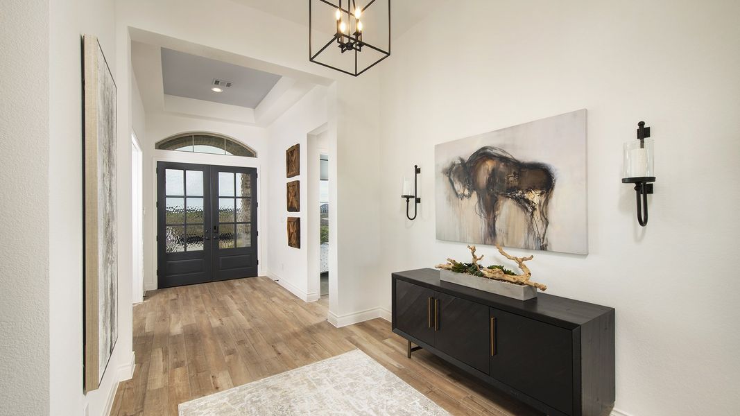 Representative furnished interior of a home built from the 3578W by Perry Homes in Lakes of Cane Island, Katy (Image 19).
