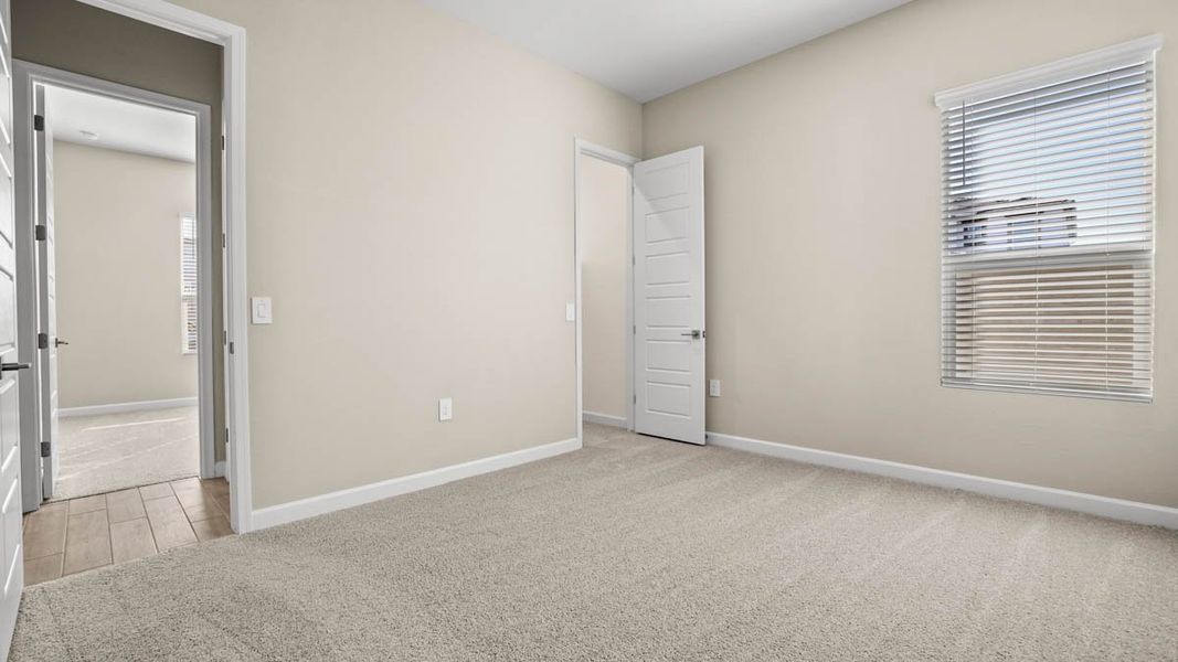 Spacious, unfurnished interior of a new home in Zanjero Pass, Waddell (Image 37).