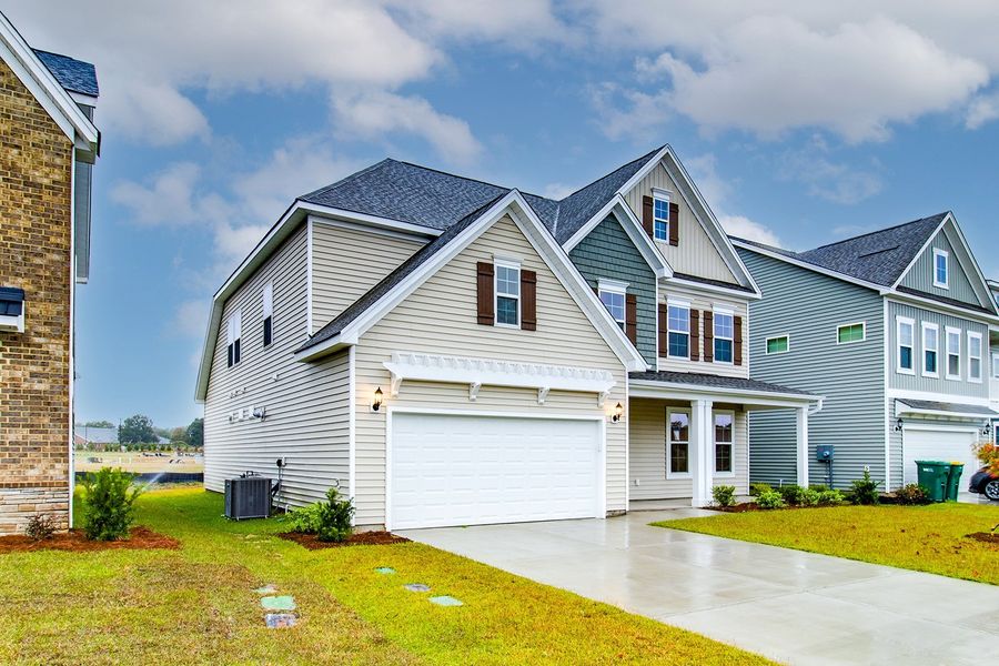 Front exterior of a new home in Hendrix Farms, Lexington, SC, highlighting curb appeal (Image 2). Front exterior of a new home in Hendrix Farms, Lexington, SC, highlighting curb appeal (Image 2).