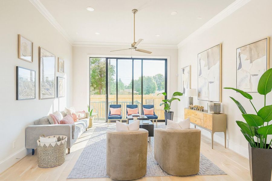 Indoor  and Outdoor Living - 10 FT Tall - Sliding Glass Doors open to back patio  and fenced-in back yard.