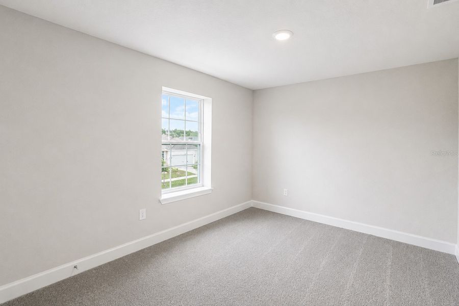 Spacious, unfurnished interior of a new home in Harmony Central, St. Cloud (Image 22).