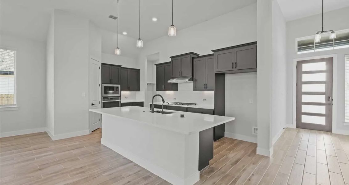 Representative furnished interior of a home built from the Summerton by Chesmar Homes in Village at Three Oaks, Seguin (Image 3).
