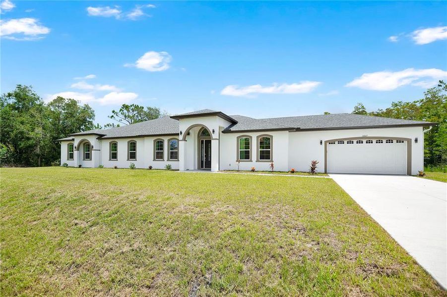 Front exterior of a new home in , Orlando, FL, highlighting curb appeal (Image 2). Front exterior of a new home in , Orlando, FL, highlighting curb appeal (Image 2).