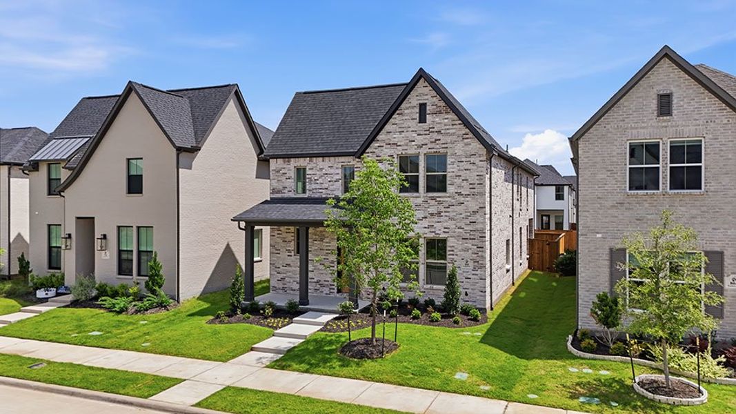 Front exterior of a new home in Light Farms Brenham - 40' Lots, Celina, TX, highlighting curb appeal (Image 26). Front exterior of a new home in Light Farms Brenham - 40' Lots, Celina, TX, highlighting curb appeal (Image 26).