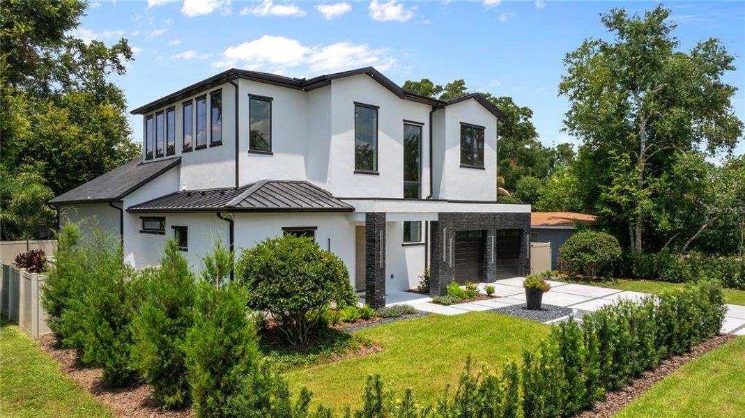 Front exterior of a new home in , Winter Park, FL, highlighting curb appeal (Image 25). Front exterior of a new home in , Winter Park, FL, highlighting curb appeal (Image 25).