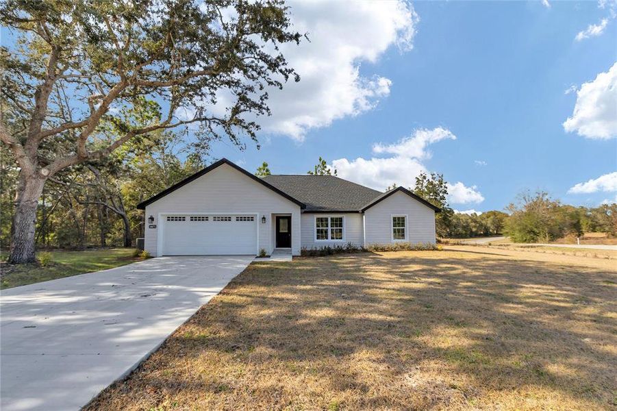 Front exterior of a new home in , Dunnellon, FL, highlighting curb appeal (Image 26).