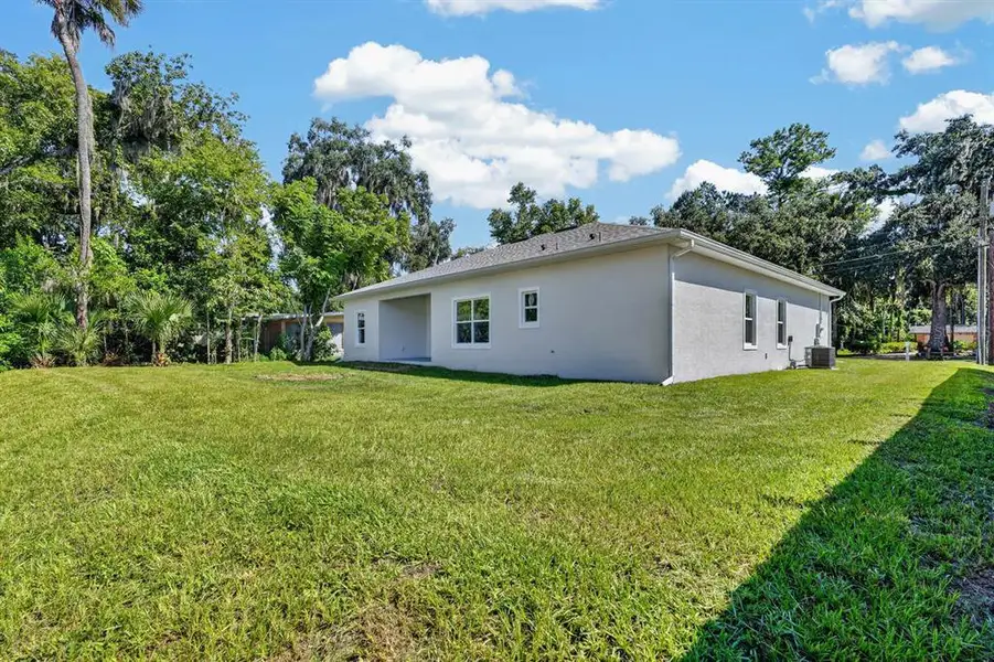 Exterior details and patio area of a home in , New Smyrna Beach (Image 25).