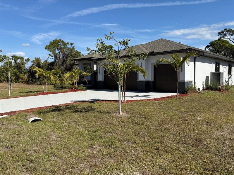 Front exterior of a new home in , Placida, FL, highlighting curb appeal (Image 20).