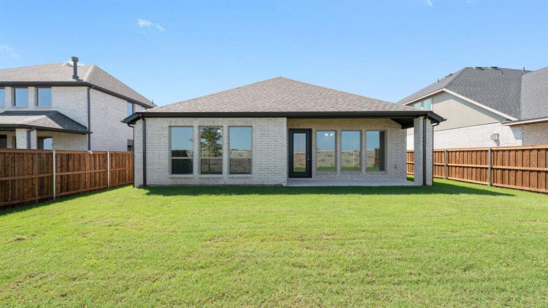 Front exterior of a new home in Trinity Falls 45', McKinney, TX, highlighting curb appeal (Image 2).