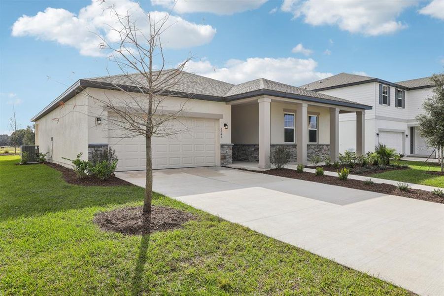 Front exterior of a new home in Tyson Reserve, St. Cloud, FL, highlighting curb appeal (Image 1). Front exterior of a new home in Tyson Reserve, St. Cloud, FL, highlighting curb appeal (Image 1).