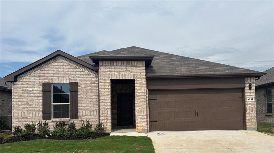 Front exterior of a new home in Terra Trace, Fort Worth, TX, highlighting curb appeal (Image 1). Front exterior of a new home in Terra Trace, Fort Worth, TX, highlighting curb appeal (Image 1).
