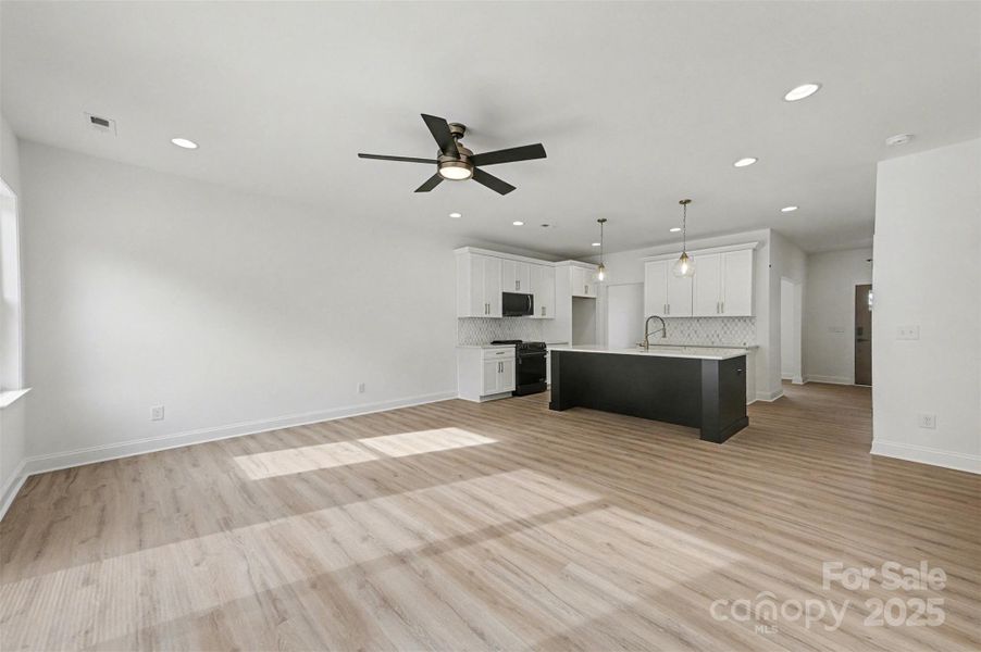 Open concept design features a kitchen that directly overlooks and connects to the family room, creating a spacious and inviting living area. Open concept design features a kitchen that directly overlooks and connects to the family room, creating a spacious and inviting living area.